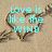A static image shows a heart drawn in sand with text about love being like the wind, visible in cyan letters.