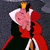 Pixelated character in red and black attire with crown, set against dark background; text "Queen Of HEARTS" on red