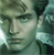 Pixelated close-up of a person's face with dark hair, light skin, and a neutral expression against a greenish background.