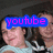 A pixelated image of two people in graduation caps and gowns with overlaid text reading 'youtube', 'subscribe to', and 'Sam and Des' in blue and pink lettering.