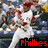 A baseball player in white uniform with red accents swings a bat, crowd visible behind him; text 'Phillies' and '<3' appear on screen.