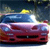 A pixelated red sports car with blue accents is centered against a dark, blurred background featuring a yellow light source.
