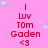 Pink background with repeated red text 'Luv Tom Gaden <3' and scattered light blue stars, static image.