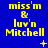 Blue background with yellow text reading "miss'm & luv'n Mitchell" and small yellow symbols like plus signs and stars scattered around.