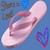 A static pixelated image of a pink and white rounded object with subtle shading against a blue background, featuring small colorful accents on the right.