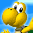 Pixelated yellow dinosaur character with large eyes and green shell, waving against blue sky background.