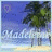 Pixelated beach scene with palm tree, ocean waves, and sandy shore under blue sky.