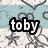 Pixelated icon with 'toby' text in white letters on black outline against light blue and beige background with gray abstract shapes.
