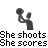 Pixelated grayscale icon of a figure holding a basketball, with text below reading "She shoots She scores" in blocky font.