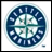 Circular blue and white logo with 'SEATTLE MARINERS' text around the edge, featuring a central cross design on a light background.