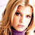 Static 50x50 pixel icon showing a close-up of a person with long light brown hair and purple clothing against a white background.