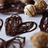A split-screen image with a blue background on the right displaying 'I LOVE CHOCOLATE!' in white pixelated text and a blurred chocolate dessert on the left.