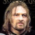 Two side-by-side pixelated images of a person with long hair, one on dark background and the other on warm-toned background.