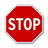 Red octagonal stop sign with white text, two versions of the sign appear in a with additional text labels below each