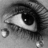 Black-and-white close-up of a human eye with tears, accompanied by blue pixelated text reading 'big girls don't cry' on a black background.