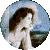 Circular icon shows a woman with brown hair in profile, wearing a white dress, against a blue sky and water background with green text overlay.
