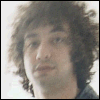 A six- shows a person with curly brown hair in a black jacket and dark pants, with text reading 'i heart albert' in the bottom-right