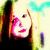 A pixelated image of a person with light hair and pink lips, wearing dark clothing against a bright background.