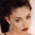 A pixelated image of a person with dark hair tied back, next to green text reading 'Original Icons .com' on a solid background.
