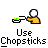 Pixelated character with white head and yellow body uses chopsticks to eat green food, transitioning from neutral expression to red face with exclamation mark.