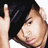 A pixelated image shows a person with dark hair holding up one finger, next to red text reading "Chris Brown Kiss Kiss" on white background.
