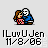 Pixel art of two figures embracing, one in pink dress with brown hair and the other in blue shirt with white mask-like face, on light gray background.