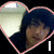 Heart-shaped frame with pink outline contains a person in dark clothing against light background; text "I Love Joe!" appears across the image.