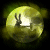 Animated circular icon with yellow-green glow showing a figure in dark clothing performing repeated actions against a small object on the ground.