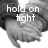 Black-and-white image of two hands clasped together with overlaid text reading "hold on tight and never let go".