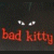 Pixelated icon with dark background showing white eyes and red text 'bad kitty' on left, green text 'Original Icons .com' on right.