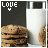 Pixelated image showing stacked cookies with a glass of milk, 'LOVE' text in top-left corner, and a small heart below the text.