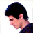 Pixelated static image of a person's head and shoulder in profile view with dark hair, light skin tone, and visible ear against white background.