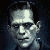 Static pixelated image of a figure with pale skin, dark hair, and visible bolts on the neck against a dark background.