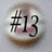 #13 icon with brown border and pinkish background, showing a basketball design on the reverse side.