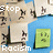 Pixelated image with 'Stop Racism' text, a green square face icon, and abstract shapes on beige and blue backgrounds.