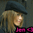 Pixelated image of a person with long light brown hair wearing a dark blue cap, facing right against a gray background.