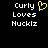 Pixelated text 'Curly Loves Nucklz' with a yellow heart symbol on the left side of the frame, displayed against a black background.