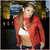 A pixelated image shows a person in a red jacket and white top on the left, with blue text reading 'Fergie' and two heart symbols on the right.