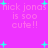 Pixelated text on a bright pink background with cyan starbursts, repeating 'nick jonas is soo cute!!' in a pattern