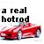Pixelated image with black text 'a real hotrod' above a red vehicle rendered in low-resolution pixels.