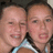 Two pixelated faces in close proximity, both smiling with visible teeth and light skin tones.