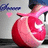 A pixelated red spherical object with a white star and pink ribbon, held by a figure with dark hair against a gray background.
