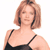 Static pixelated image of a person with short brown hair wearing a black spaghetti-strap top against a white background.