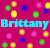 Pixelated icon with bright cyan text 'Brittany' on a magenta background surrounded by scattered yellow, green, blue, and pink circles.