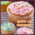 Pixelated image of three pastel-colored cupcakes with sprinkles on a wooden surface.