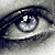 A grayscale close-up of a human eye with blue irises, overlaid with changing purple pixelated text in a