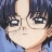 Pixelated close-up of a character with dark hair and glasses, light skin, and a neutral expression against a blue background.
