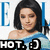 Pixelated image of a person with shoulder-length dark hair wearing a light blue off-shoulder top, with partial text elements visible.