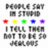 Pixelated text and colored dots on a split background with pink text elements.