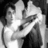 Black-and-white pixelated image of two people embracing on the left, red background with yellow pixelated text on the right reading "OH MY GOD HE IS THE CUTEST WIZARD EVER<3".